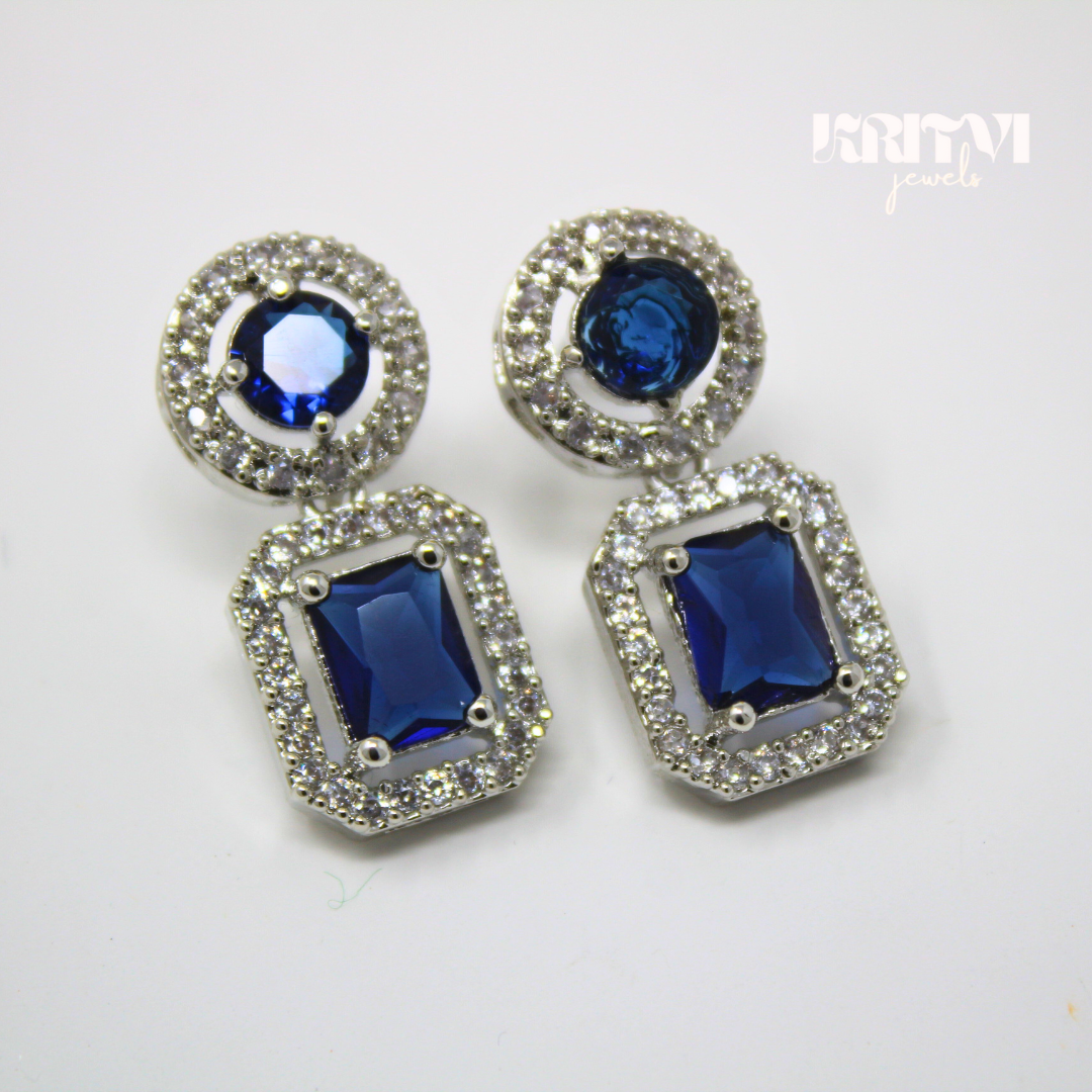 Emerald Blue Halo Drop Earrings Set in Silver Finish